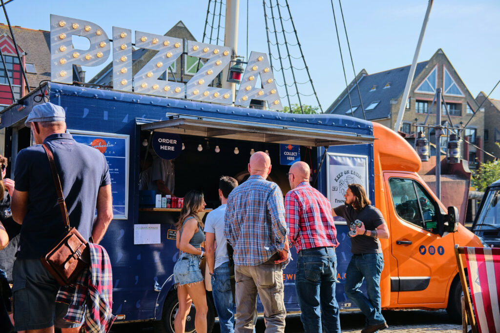 Guests lined up for a pizza food truck
